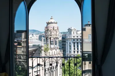 a view of a city from a window at Safestay Barcelona Passeig de Gràcia in Barcelona