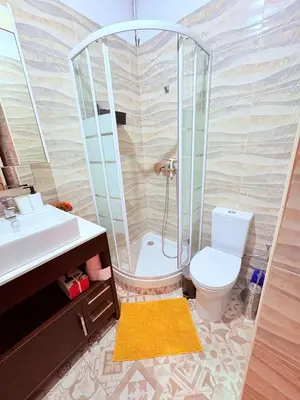 a bathroom with a shower and a toilet and a sink at Amazing and stylish flat for 4 people with breakfast included 2 blocks away from Poblenou beach in Barcelona