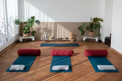 a yoga room with a bunch of yoga mats at Mas Vives, exclusiva masía del siglo XV in Cabrils