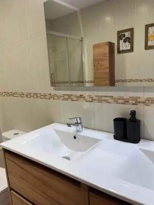 a bathroom with a white sink and a mirror at Can Sura in Campíns