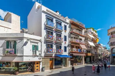 a street in the city of tropez with buildings at InSitges Center in Sitges