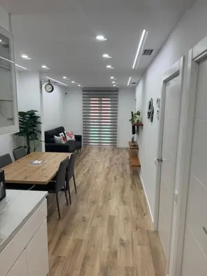 a living room with a table and a couch at Apartamento Plaza España - Bordeta BCN in Barcelona
