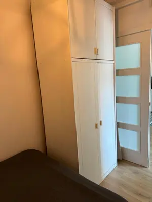 a bedroom with a white cabinet and a door at Unique Ramblas in Barcelona