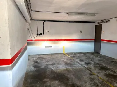 an empty garage with a red and white wall at Apartment Rivel in Cubelles