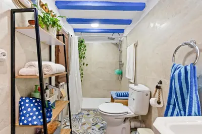 a bathroom with a toilet and a sink at Atenea Room by the Beach - Claire Homes in Castelldefels