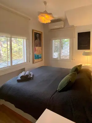 a bedroom with a large bed with two pillows on it at Pineda 38 in Gavà