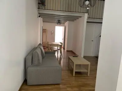 a living room with a couch and a table at SA 15min downtown Barcelona, 5min Metro, Beach nearby in Sant Adria de Besos
