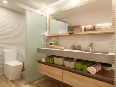 a bathroom with a sink and a toilet at Cabril's Hills Luxe Suites in Cabrils
