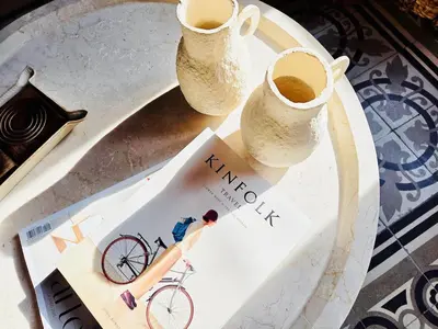 a table with two vases and a book on a bike at Stunning APT WiFi 6 min Sagrada Familia 2BR in Barcelona
