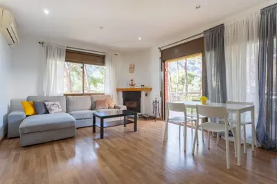 a living room with a couch and a table at Apartamento en castelldefels in Castelldefels