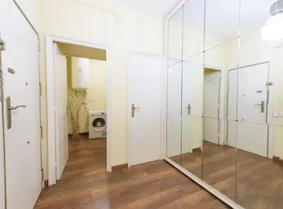 a large mirror in a room with white doors at Ramblas Rentals Spacious & Design 4Br Flat With Balcony 15m Ramblas in Barcelona