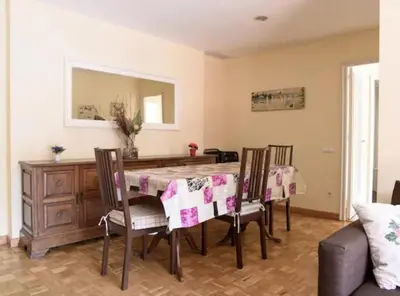 a dining room with a table and chairs at Ramblas Rentals Unique & Spacious Flat 4BR Terrace 20M Ramblas in Barcelona