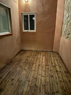 an empty room with a window and a wooden floor at Rustic Casita Gavà in Barcelona