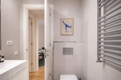 a bathroom with a toilet and a sink at Spacious and elegant oasis in the best location, Eixample Barcelona in Barcelona