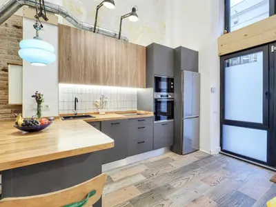 a kitchen with a wooden counter top and a refrigerator at Concordia - Beautiful flat, spacious, central 4 rooms , 2 bath in Barcelona