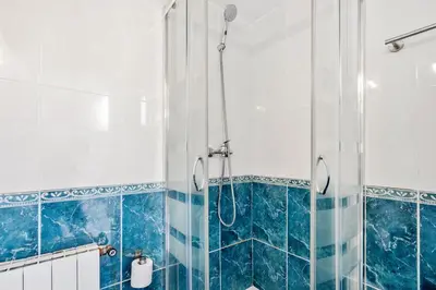 a bathroom with a toilet and a sink and a shower at 5BR for 7 Elevator Walk to Sant Antoni in Barcelona