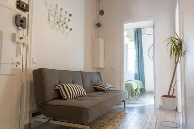 a living room with a couch and a bedroom at 