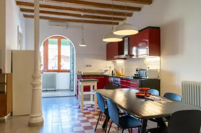 a kitchen with a table and chairs in a room at 