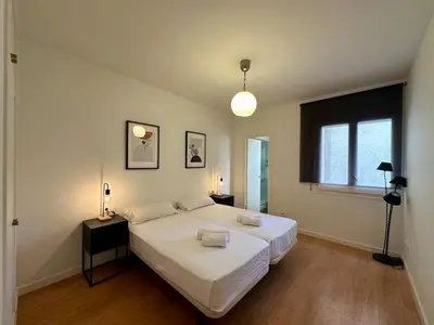 a bedroom with two beds and a window at Spacious 1 bedroom home in Bonanova in Barcelona