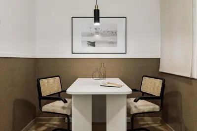 a white room with a table and a lamp at Sabate - 3 bedrooms and office in Sant Gervasi in Barcelona