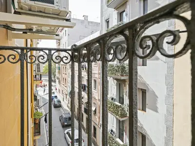 a view of a city street from a balcony at Winahost La Barceloneta in Barcelona