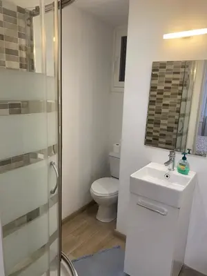 a bathroom with a toilet and a sink and a shower at Apartamento Barcelona in Barcelona