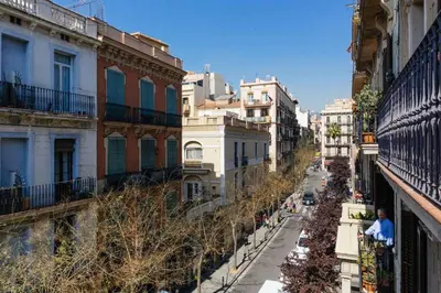 a view of a city street with buildings at Nice apartment in Gracia - Torrent de l'Olla in Barcelona