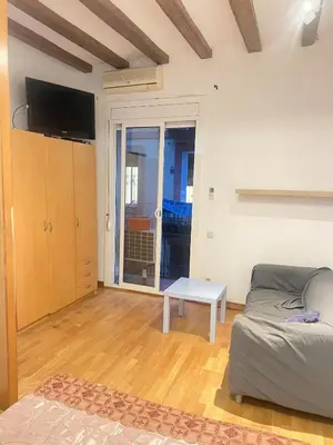 a living room with a couch and a table at Flat in centre of Barcelona in Barcelona