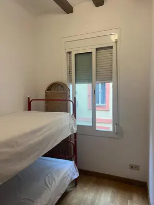 a room with two bunk beds and a window at Flat in centre of Barcelona in Barcelona