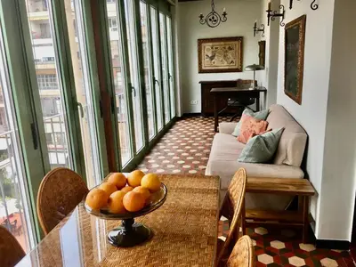 a living room with a table and a couch at Fabulous Luxury in Best Location of City Centre in Barcelona