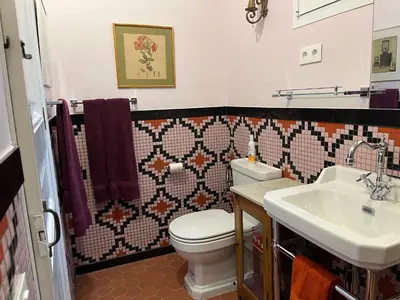a bathroom with a toilet and a sink at Fabulous Luxury in Best Location of City Centre in Barcelona