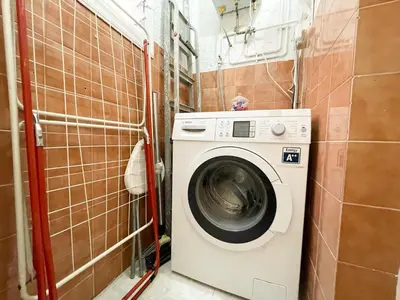 a washer and dryer in a small bathroom at Boutique Radas in Barcelona