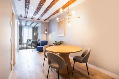 a dining room with a wooden table and chairs at E2MAL1052 - Fantastic apartment next to Sagrada Fa in Barcelona