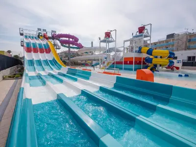 a water park with a slide and water slides at Golden Taurus Aquapark Resort in Pineda de Mar