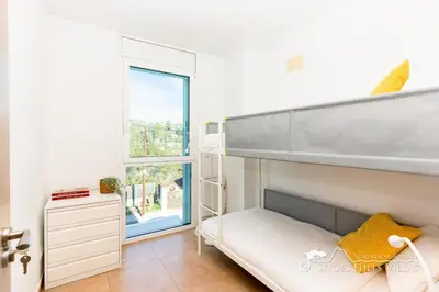 a bedroom with two beds and a large window at Villa Senita with Private Pool, close to Sitges in Olivella