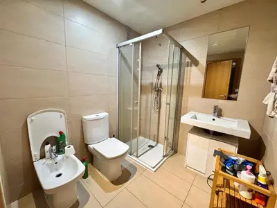 a bathroom with a toilet and a shower and a sink at Apt compartido martirrena in Badalona