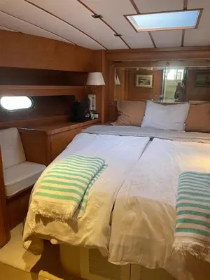 a bedroom with a large bed on a boat at Waterfront Cozy two bedrooms in Barcelona