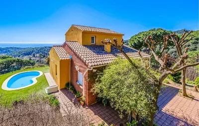 an external view of a house with a swimming pool at Stunning Home In Arenys De Munt in Arenys de Munt