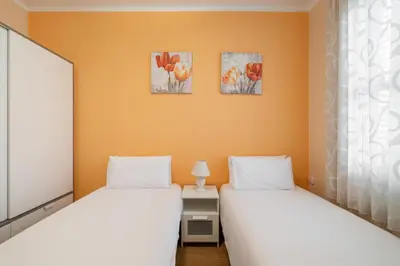 two beds sitting next to each other in a room at Stay U-nique Apartments Lepant II in Barcelona