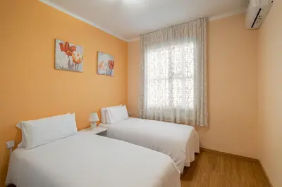 two white beds in a room with a window at Stay U-nique Apartments Lepant II in Barcelona