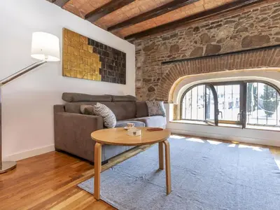 a living room with a couch and a table at Apartment Icaria by Interhome in Barcelona