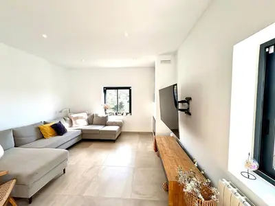 a living room with a couch and a table at Mi casa soñada in Sant Pere de Ribes