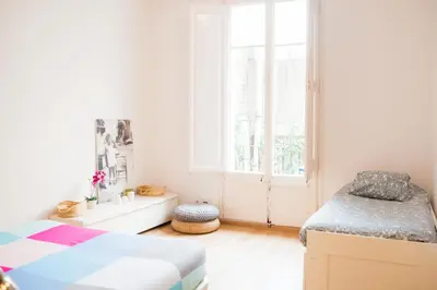 a bedroom with a bed and a window at Central apartment in Sant Antoni in Barcelona