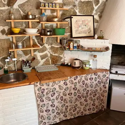 a kitchen with a counter with a sink at Estudio limonero en Sant Cebriá de Vallalta 20' playa in Sant Cebrià de Vallalta
