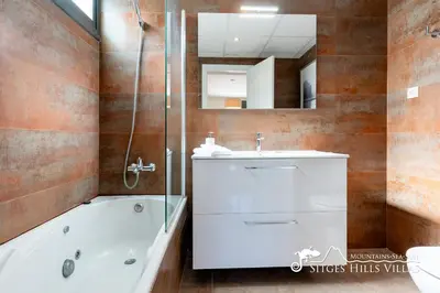 a bedroom with a bed and a window with a view at Cool and Stylish Villa Avanti with Private Pool, Beautiful Views and Air Conditioniing in Olivella