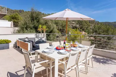 a villa with a swimming pool and patio furniture at Cool and Stylish Villa Avanti with Private Pool, Beautiful Views and Air Conditioniing in Olivella