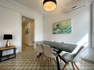 a dining room with a table and chairs at Stay U-nique Apartments Comte Urgell in Barcelona