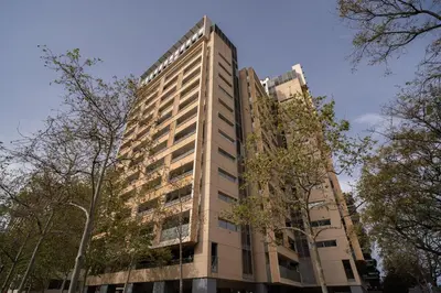 a tall building with trees in front of it at Av d'Eduard Maristany, 13 in Sant Adria de Besos