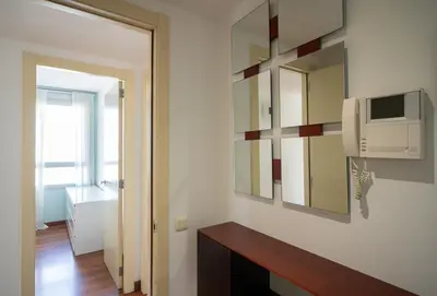 a bathroom with a mirror and a sink and a television at Av d'Eduard Maristany, 13 in Sant Adria de Besos