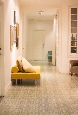 a yellow couch in a room with a hallway at Forget Me Not Barcelona in Barcelona